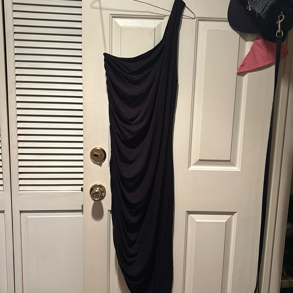 One shoulder dress, never worn, ruched down right side, with an asymmetrical hem